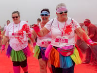 Runners covered in the colours of the rainbow for charity fun run