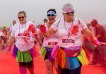 Runners covered in the colours of the rainbow for charity fun run