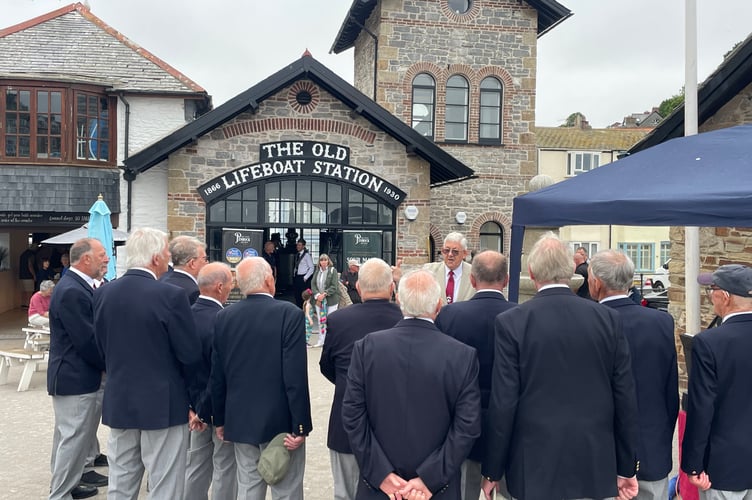 Members of the Pelynt Male Voice Choir perform in front of the refurbished Old Lifeboat Station and Watchtower in Looe. Picture: (Cornish Times)