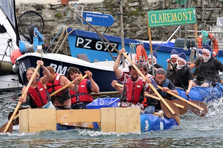 Teams taking part in the annual raft race as part of the Polperro Water Carnival. Picture: (Polperro Water Carnival/Facebook).