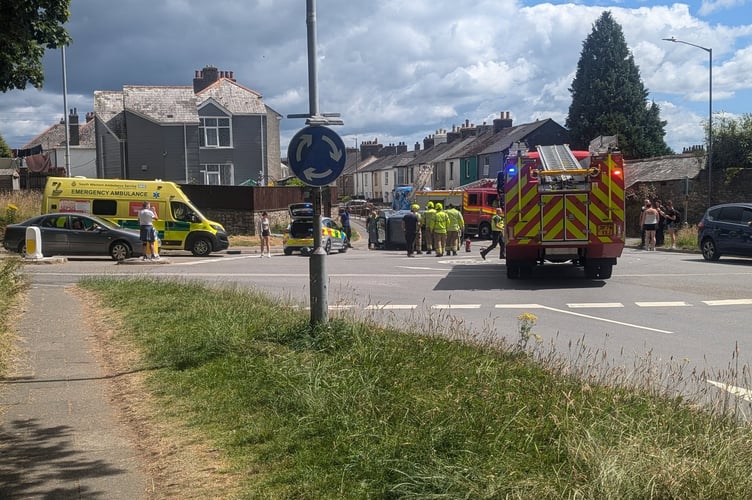 Emergency services on the scene of the collision on Callington Road in Liskeard. Picture: (Dan Clements)
