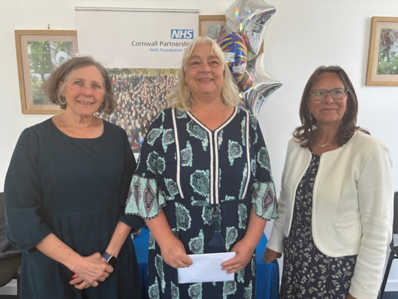 Ali Pedlar (centre) receives her Long Service certificate from Trust chair Margaret Schwarz (left) and chief executive Debbie Richards (right)