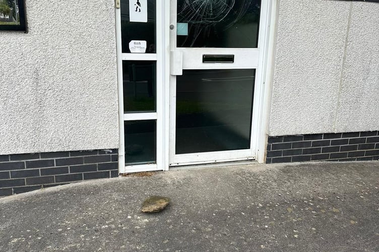 Vandals smashed the door at Saltash Community Fire Station with a rock