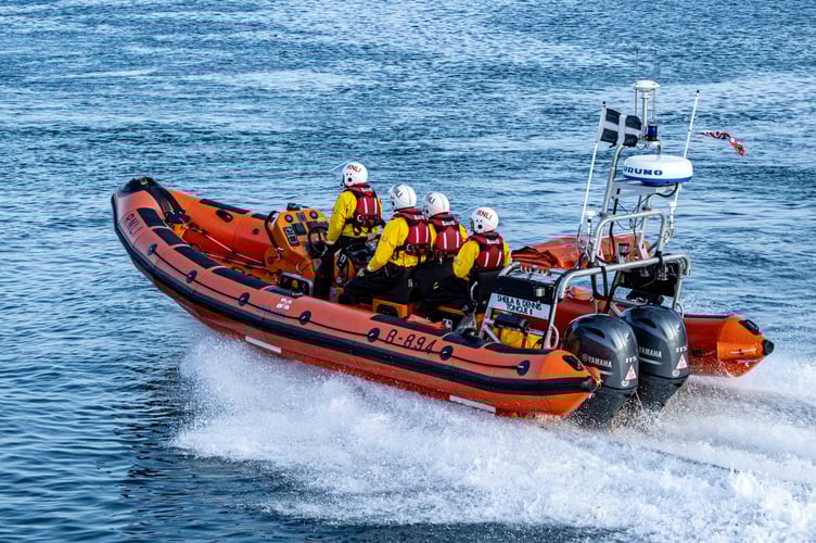 Looe RNLI Atlantic 85 Sheila and Dennis Tongue II heading out into Looe bay. Photo credit 	RNLI / Ian Foster