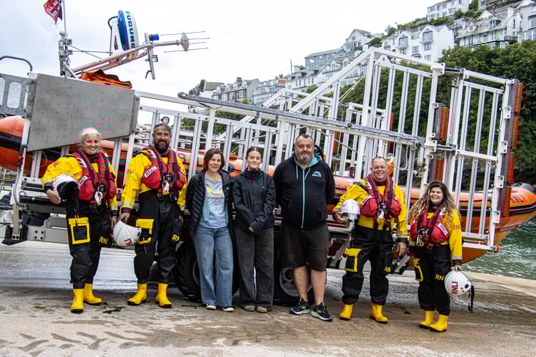 Rachel, Evie and Paul Toms with Looe RNLI volunteer crew members Victoria, David, Clive and Amber (Picture: Looe RNLI/Ian Foster)