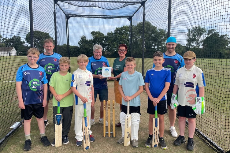 Saltash Cricket Club president Neill Kelliher is presented with a plaque from Sarah Perkins, SW Community Coordinator for Samworth Brothers, who have given the club a grant of £11,000 for new equipment for the club's thriving youth section