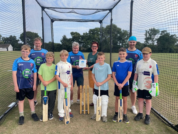 Saltash Cricket Club president Neill Kelliher is presented with a plaque from Sarah Perkins, SW Community Coordinator for Samworth Brothers, who have given the club a grant of £11,000 for new equipment for the club's thriving youth section