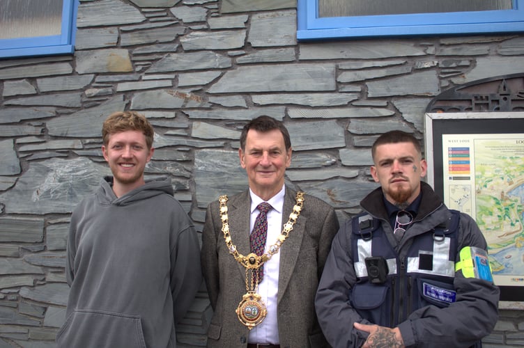 Jamie Pearn, Chair of Looe Business Forum, Looe Town Mayor  Stephen Remington and a representative from Poseidon Town Security