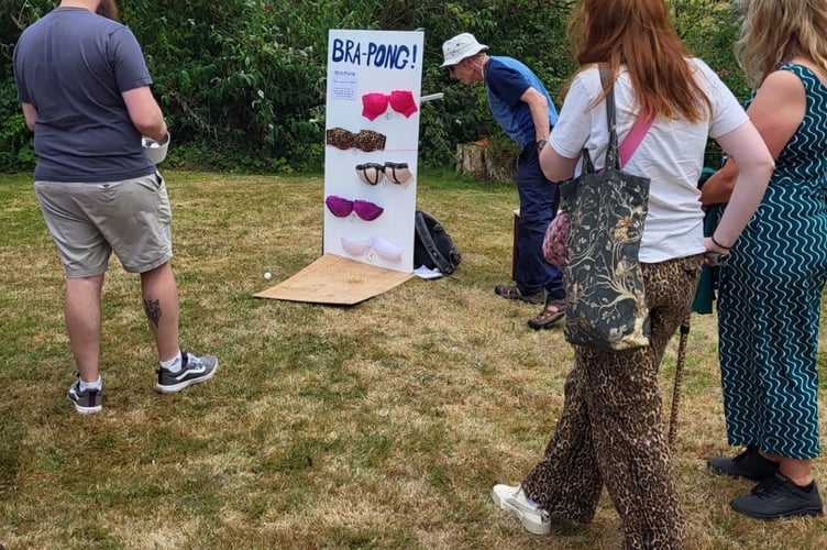 Mr Alan Henshaw running the "bra pong" game at Lansallos Fete