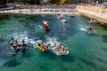Crowds line shore to watch madcap raft race