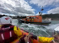 Lifeboats called to rescue pair drifting in inflatable boat off coast