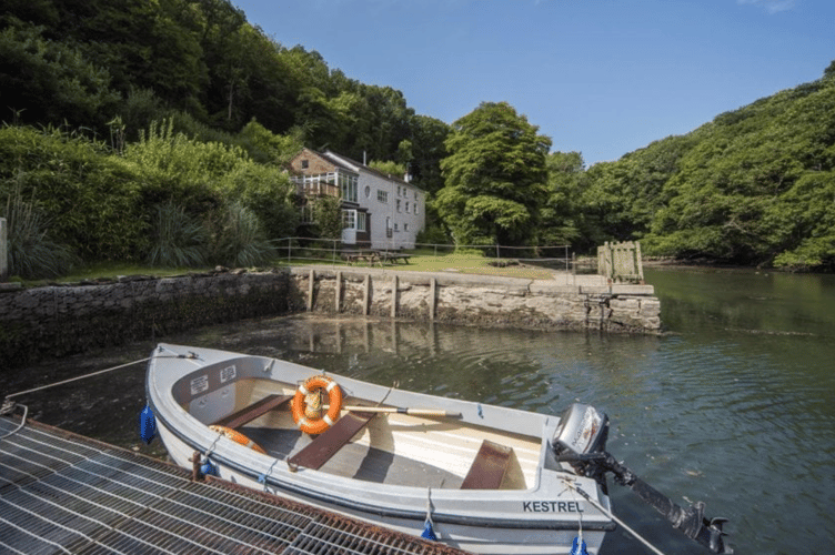The property is only accessible by boat or on foot through 32 acres of ancient woodland (Picture: Stags Estate Agents)