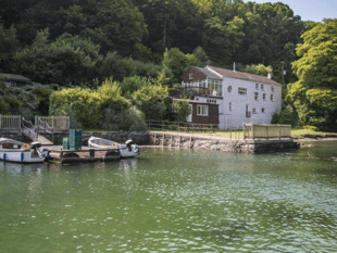 Riverfront estate with rock history and private studio up for sale