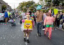 Thousands watch village carnival parade