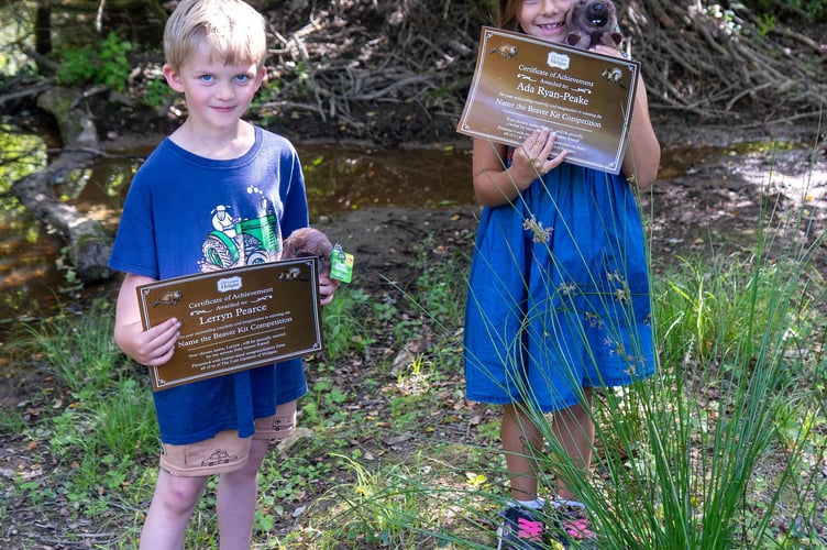 Lerryn (left) and Ada visit the Heligan beaver enclosure to receive certificates to celebrate their winning names.
