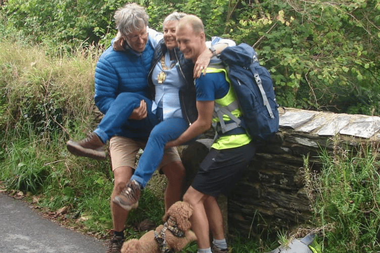 Former Saltash mayor Cllr Julia Peggs being bounced on the first stone during last year's Beating of the Bounds