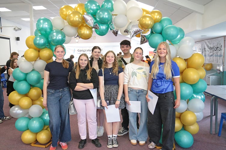 Students at Saltash Community College are all smiles after picking up their GCSE results on Thursday