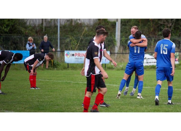 Max Gilbert and Matt Andrew (11) celebrate Liskeard's match-clinching goal at Millbrook on Saturday.