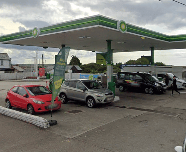 Man who climbed onto roof of petrol station arrested
