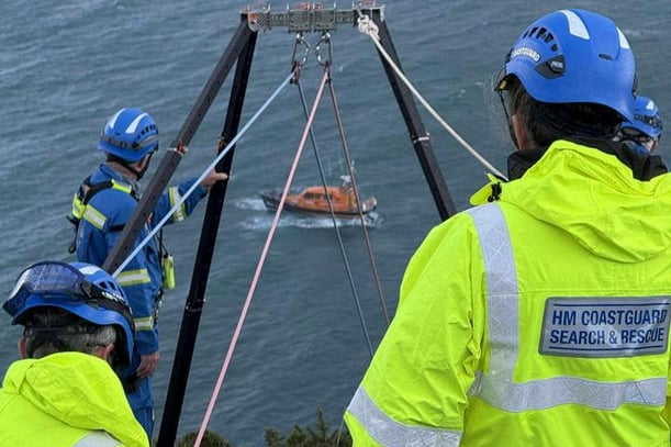 A rescue team went over the cliff to the stranded fisherman. (Picture: Mevagissey Coastguard)