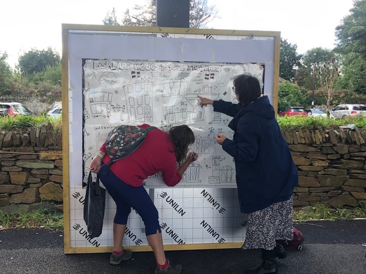 Adults and children joined Dandy & Beano cartoonist Nick Brennan to create a giant community drawing of Liskeard’s buildings