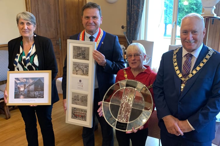 Civic leaders from both Quimperlé and Liskeard exchange gifts during the recent twinning visit