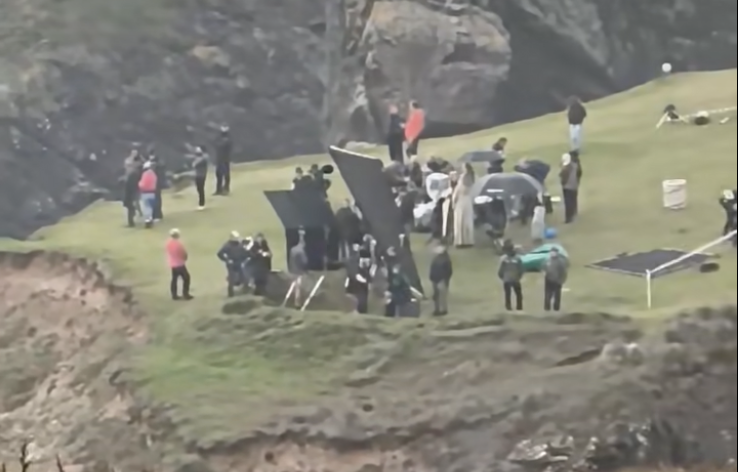 Cast and crew, including John Lithgow as Professor Dumbledore, filming at Kynance Cove on Wednesday