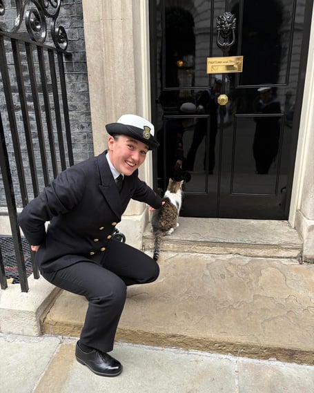 MaPS student from Duchy Emily Borner getting up close and personal to Larry the cat at Number 10. 