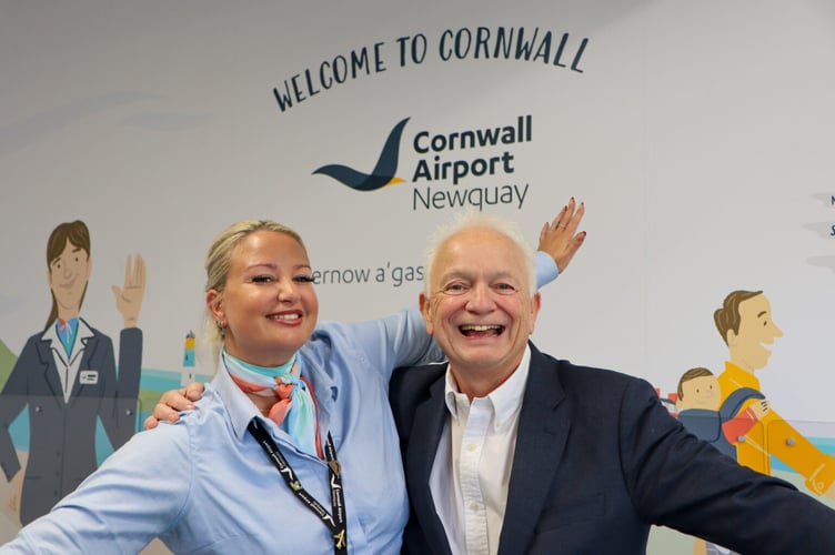 (L-R) Ryanair passenger services agent Laura with CEO of Ryanair, Eddie Wilson, during his visit to Cornwall Airport Newquay 