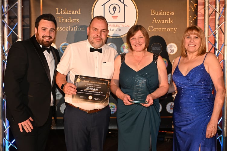 Gavin Cole and Lorraine Dearlove collecting the ‘Best Family Owned Business’ award on behalf of HBH Woolacotts Liskeard