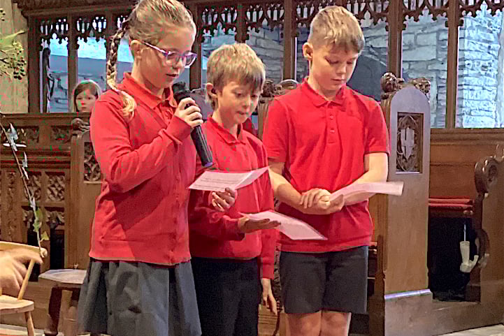 Pupils taking part in the harvest festival service at Menheniot.