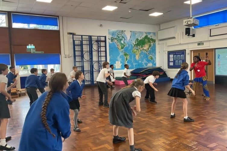 Pupils taking part in a high-energy dance workshop.