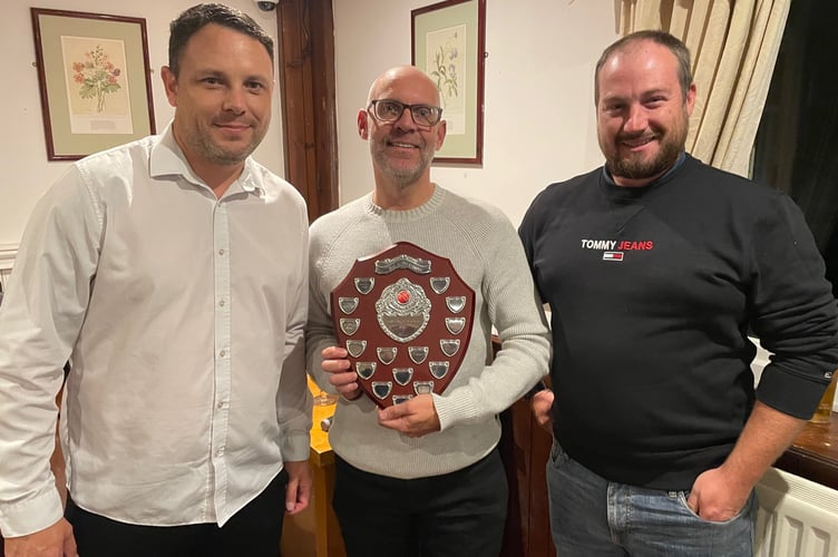 Duncan Nobes (centre) receives the Saltash CC second team batsman of the year award from Shayn Rencher and Curtis Barlow
