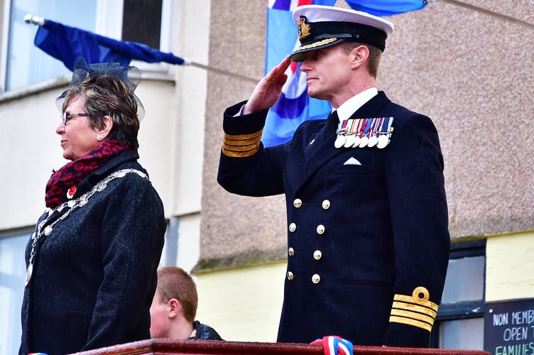Torpoint town mayor, Cllr Julie Martin and Captain Captain Jeremy Ussher, Commanding Officer of HMS Raleigh, take the salute during the town's Remembrance Day service. (Picture: Andy Campfield)