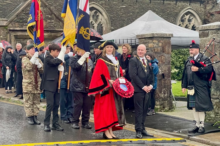 Saltash town mayor, Cllr Rachel Bullock prepares to lay a wreath at the town's war memorial