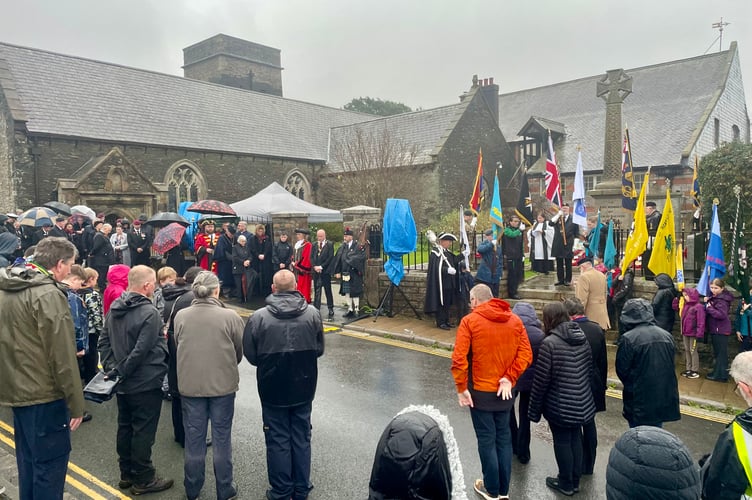 The people of Saltash observe a moment of silence to remember those who paid the ultimate sacrifice