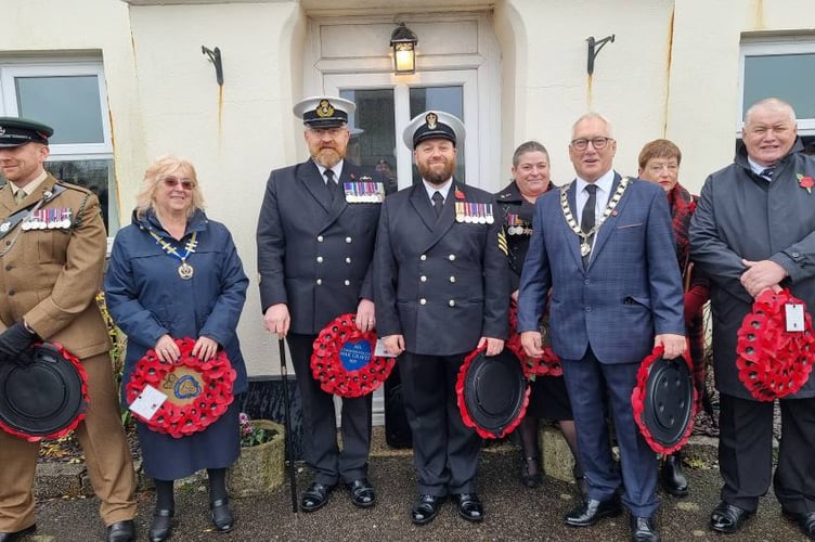 Dignitaries at Liskeard's Remembrance Day service line up ahead of the wreath laying ceremony