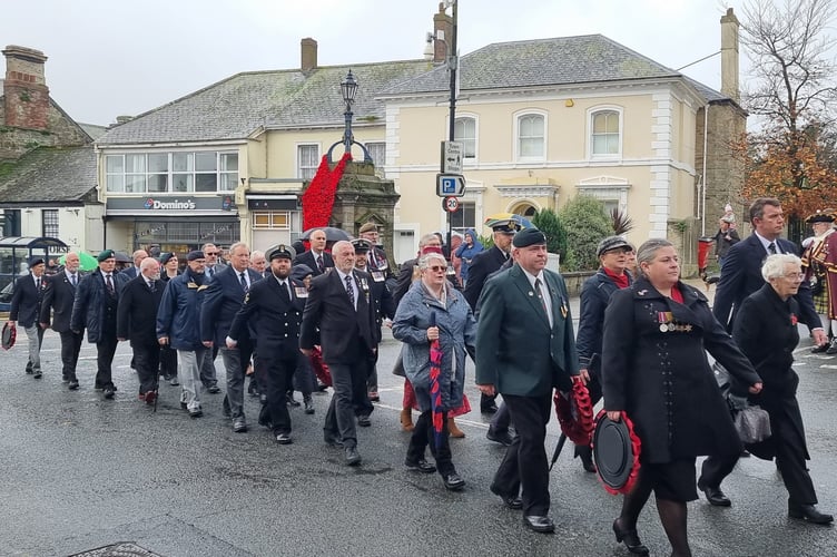 Military veterans make their way through the streets of Liskeard on Sunday