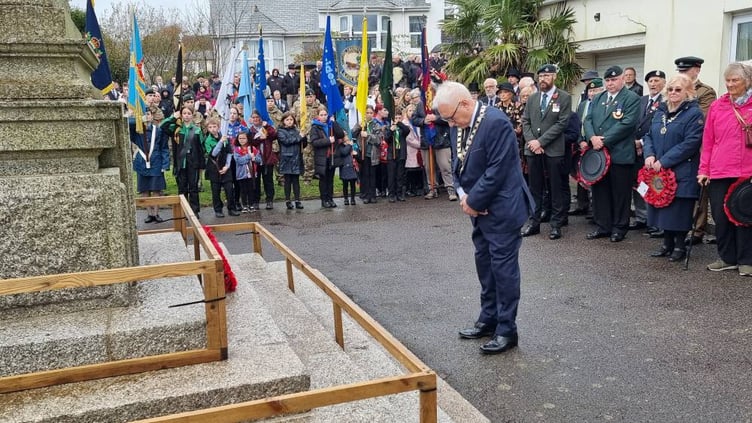 Liskeard deputy mayor, Cllr David Braithwaite, lays a wreath at the town's war memorial