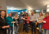 Saltash youth groups celebrate funds raised by local running hero