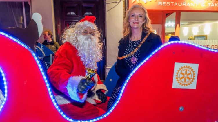 Father Christmas and Saltash town mayor, Cllr Rachel Bullock took to the streets in their sleigh. (Pictures: Mike Pitches Media)