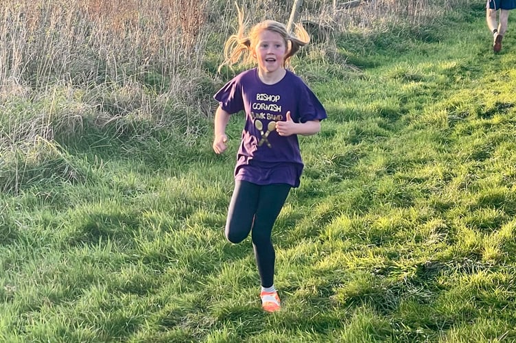 Millie O'Brien from Bishop Cornish Primary on her way to winning the Year 3/4 Girls race