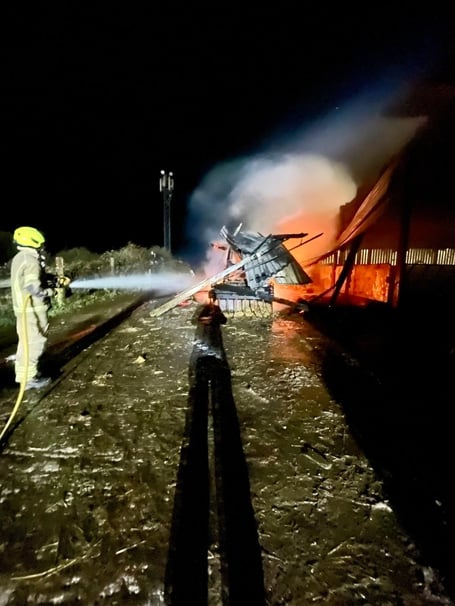Fire crews tackle the barn fire at Downderry