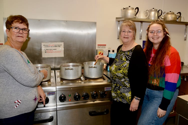Ann Parsonage and Pam Michael preparing the mulled wine