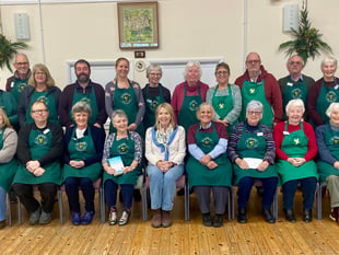 Star guest joins villagers to mark five years of community shop
