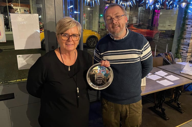 Angie from Angie's Barbershop in Liskeard is presented with the Business of the Year award by Geoff Lewis at the Liskeard Small Business Awards held at the Fat Frog Cafe. (Picture: Cornish Times)