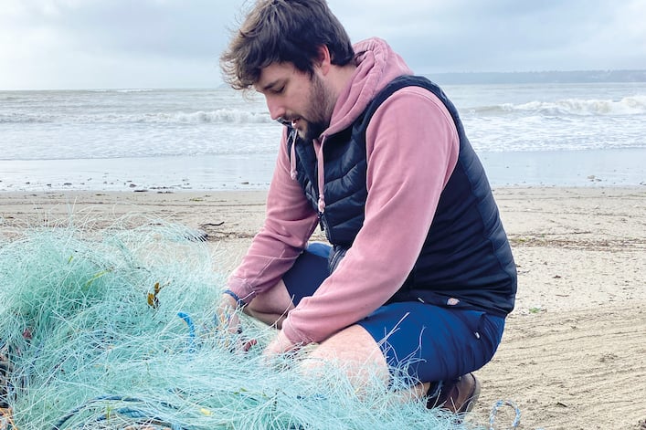 Sam Gill, of Behaviour Change Cornwall, with some of the ghost fishing gear.