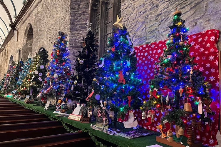 A wall of colour at St Nicholas and St Faith Church in Saltash for the annual Christmas Tree Festival