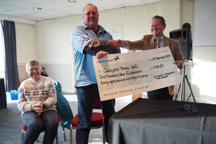 Paul Osborne  presents a cheque to the founders of Callington Memory Cafe, Keith Harris and wife Christina. 