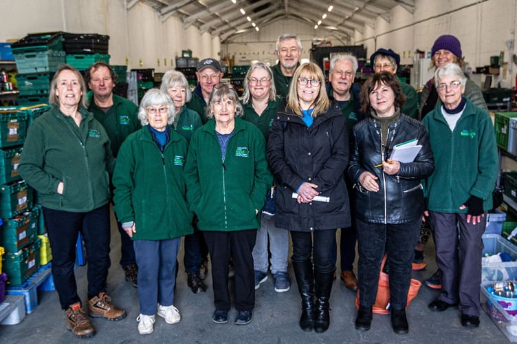 Volunteers from the Foodbank alongside Liskeard town councillors Tracey Adams and Lori Reid at their warehouse at Trevecca